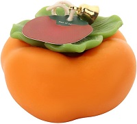 Orange and persimmon shaped and scented candle